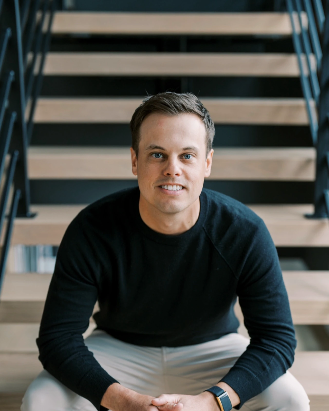 Taylor Ford, Founder of goodfolk, seated on stairs